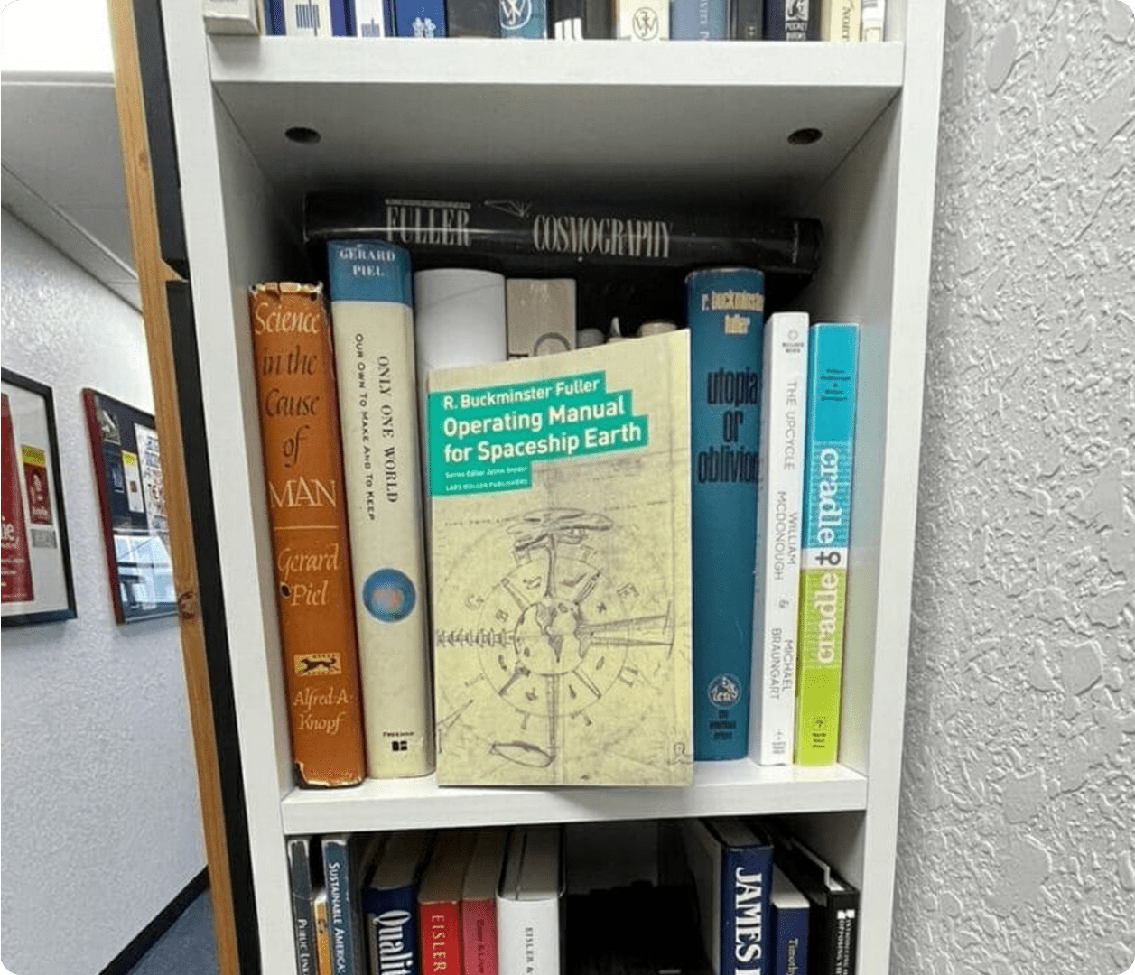 Bookshelf with "Operating Manual for Spaceship Earth