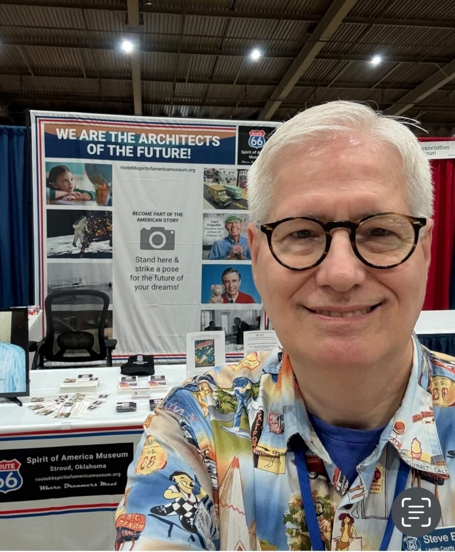 Person smiling at Route 66 museum booth